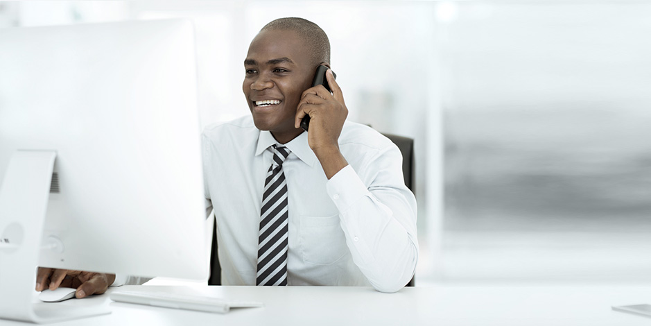 Smiling businessman talking on phone